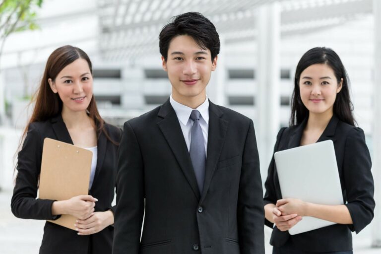 business-team-standing-together-2023-11-27-05-08-39-utc
