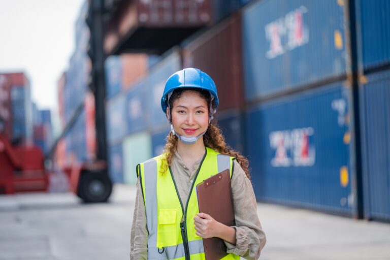 Cargo container worker checking and control loading Containers box in warehouse